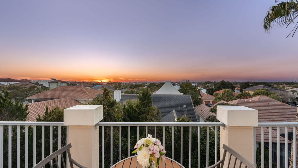 Breathtaking sunset views from the private upper-level balcony.