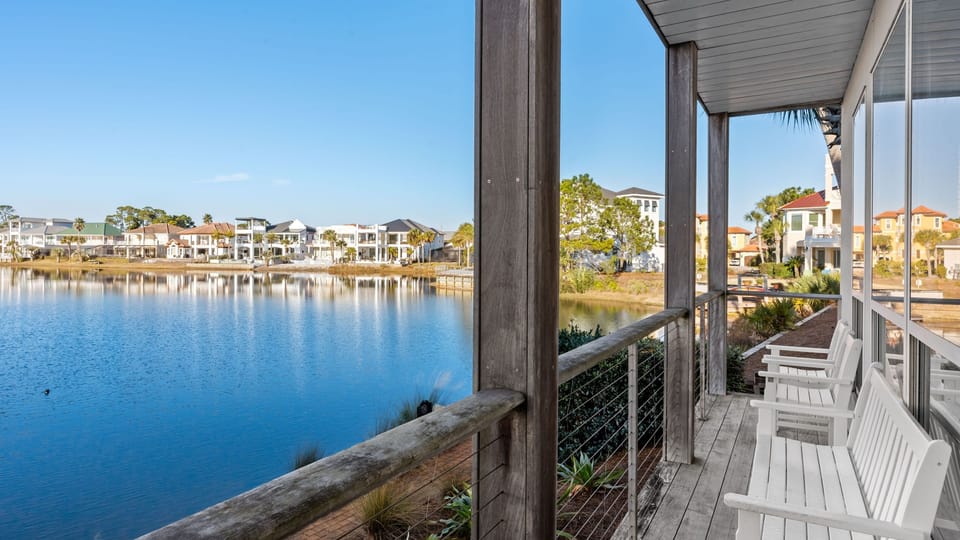Peaceful porch seating with serene lake views—perfect for morning coffee, sunset chats, and soaking up the coastal calm.