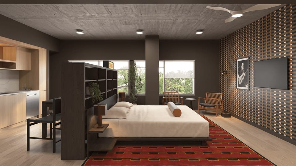 Modern resident lounge/media room with plush seating and a minimalist entertainment setup.