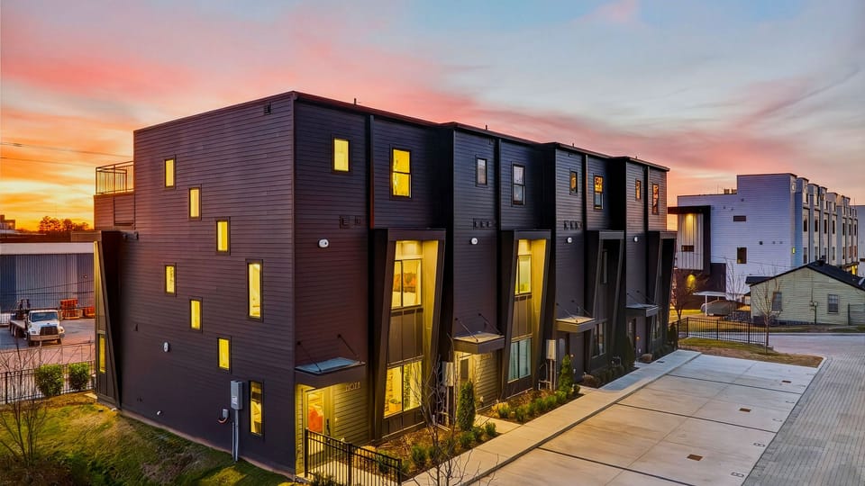 Modern Nashville townhome stay—sleek exterior, easy parking, and rooftop vibes waiting upstairs.