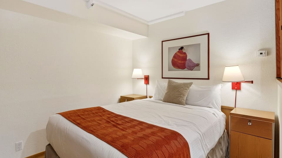 Bedroom 1 features a queen bed.