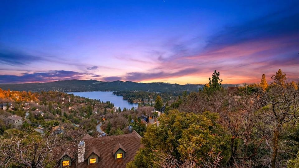 Sunset horizon over the lake and mountains.