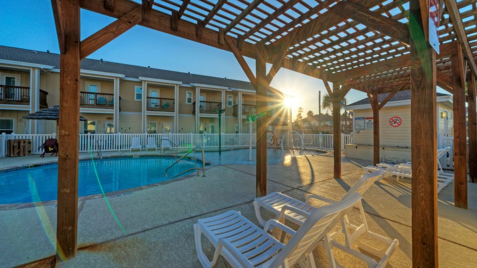 Resort-style community pool &amp; shaded pergola—perfect for sunny afternoons.