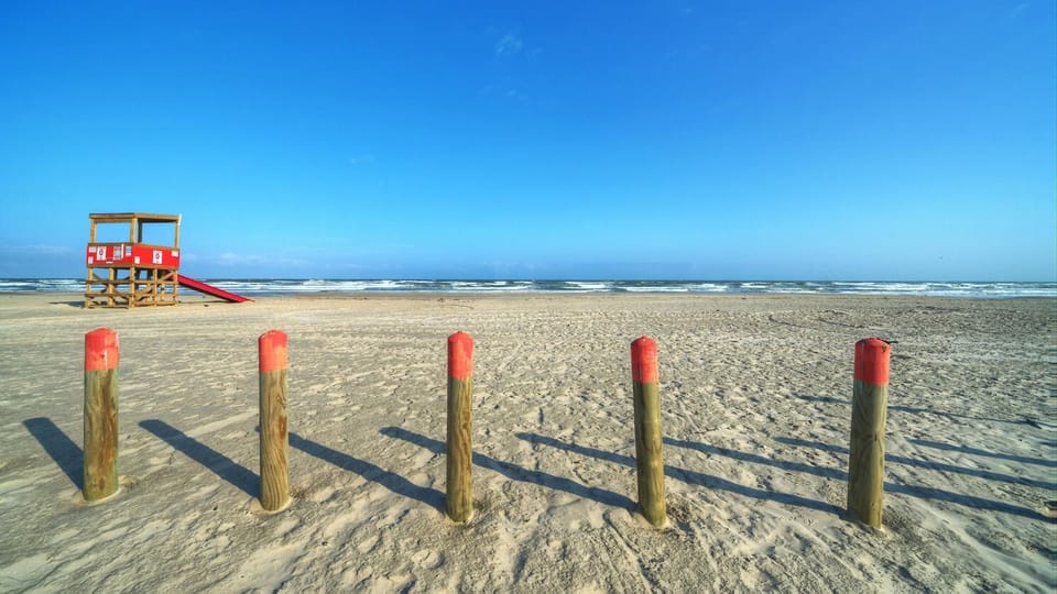 Baskin' in sunlight with sandy toes and salty hair.
