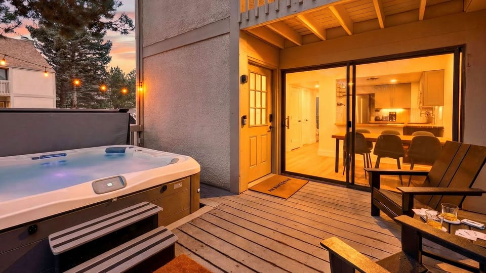 Après starts here—soak in the private hot tub, sip by the firelight glow, and step inside to a warm, inviting condo retreat.
