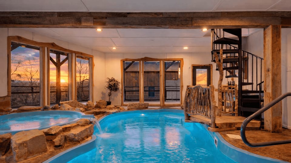 Private indoor pool with a hot tub, waterfall features, and space to unwind year-round.