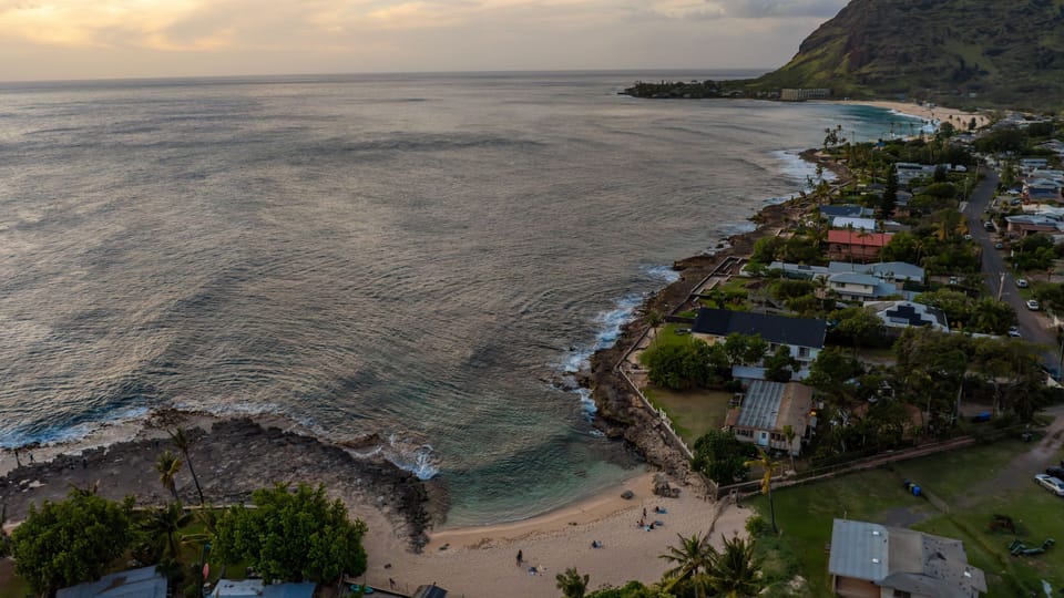 Golden sunset spilling across the ocean—your front-row seat to island evenings.