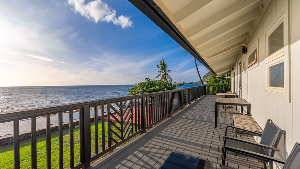 Sunlit oceanview lanai—sip your morning coffee with endless Pacific views.