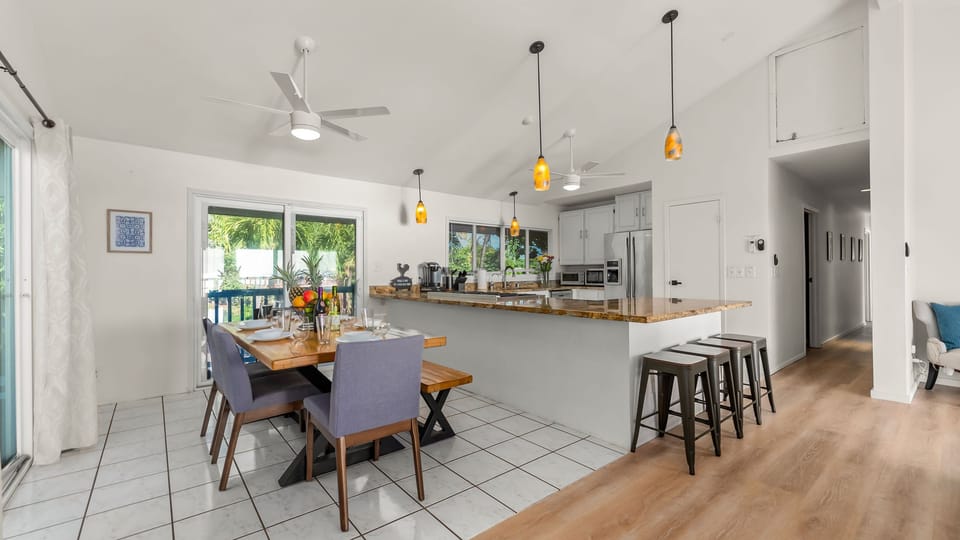 Bright open-concept kitchen &amp; dining—perfect for shared meals and easy island hangouts.