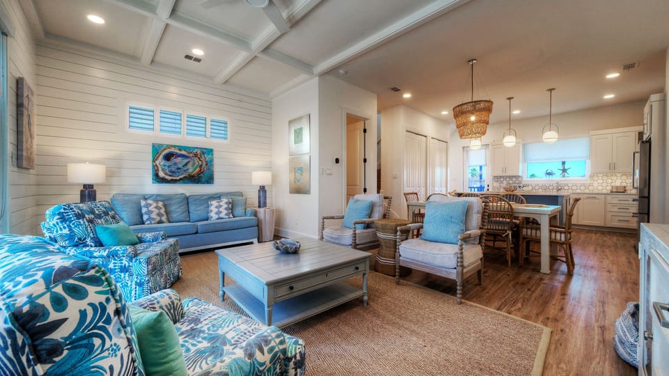 Open-concept living area with comfortable seating and a view toward the dining space. (Southern Cross)