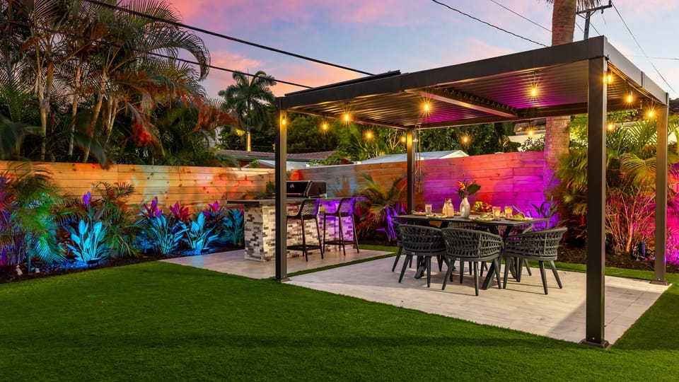 Covered outdoor dining and grill area for relaxed evenings outside.