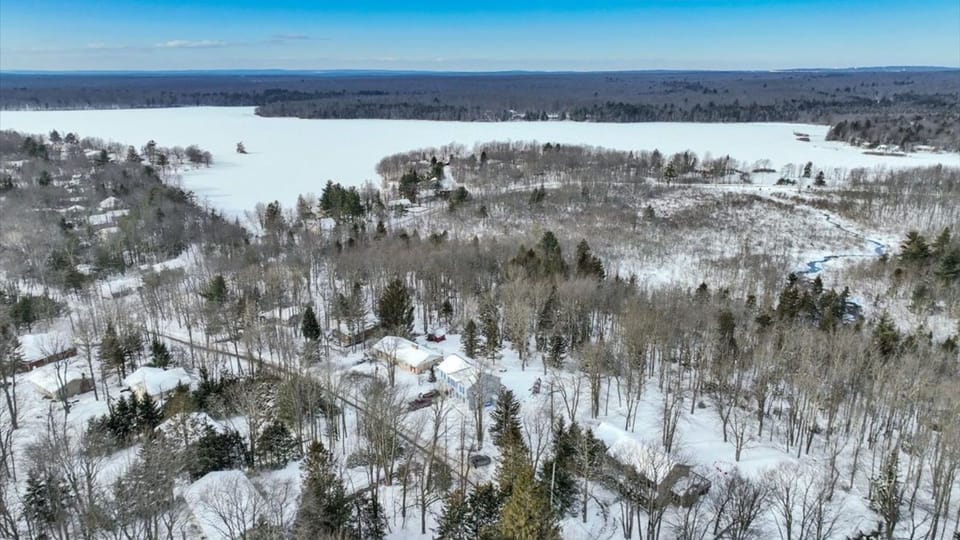 Winter serenity from above—your private Pocono escape tucked in the trees in proximity to the lake.