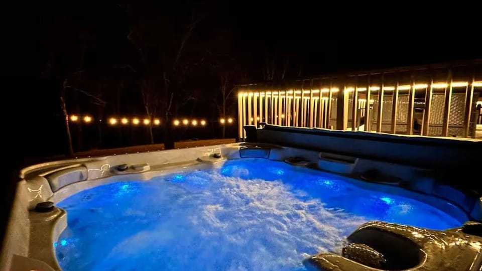 Soak under the stars—private hot tub with glowing lights for the ultimate Poconos nightcap.