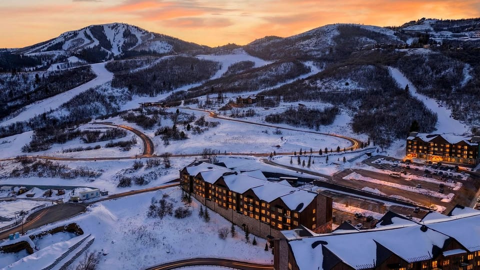 Golden-hour Park City magic—snowy peaks, ski runs, and a glowing mountain village just outside your door.