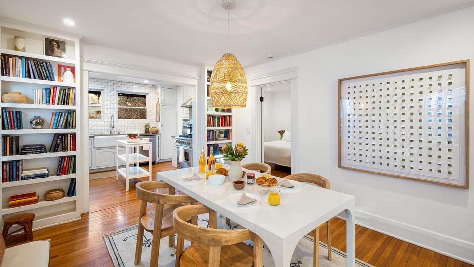Sunny dining area with an easy flow to the kitchen and nearby bedroom.