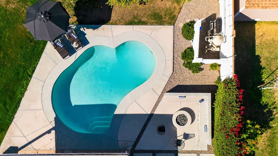 Direct overhead shot of the pool and patio layout.