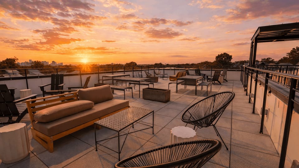 Shared rooftop terrace with multiple seating and tables.