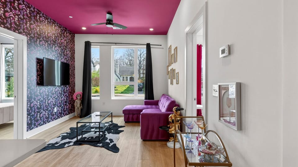 A vibrant living area with bold design, luxe seating, and a playful Nashville vibe.