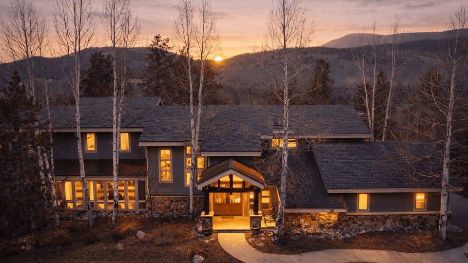 Unwind in the private outdoor hot tub as the sun sets over the pines.