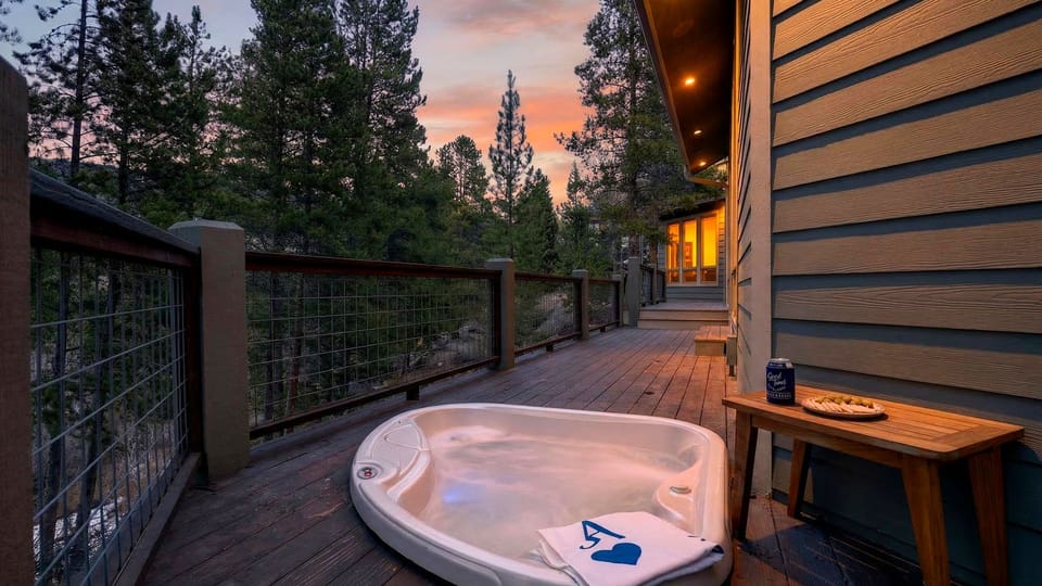 The primary bedroom features a king bed, TV, fireplace, balcony access and an ensuite bathroom.