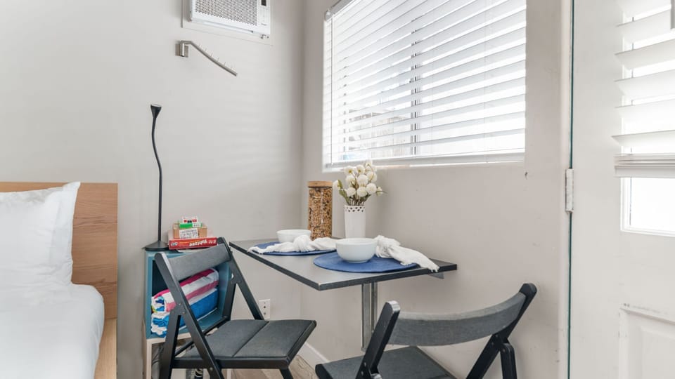 Enjoy a private dining nook for two, bathed in soft natural light.