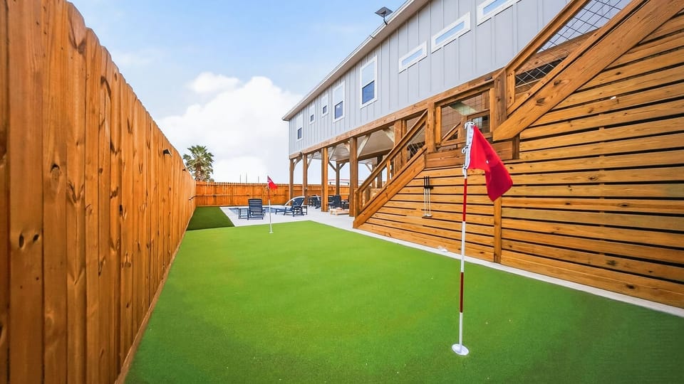 Practice your putt steps from the pool, then kick back in the shaded lounge area. (Yahwaves)