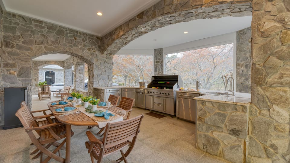 The guest house offers an additional living area, table, kitchen, and two bedrooms.