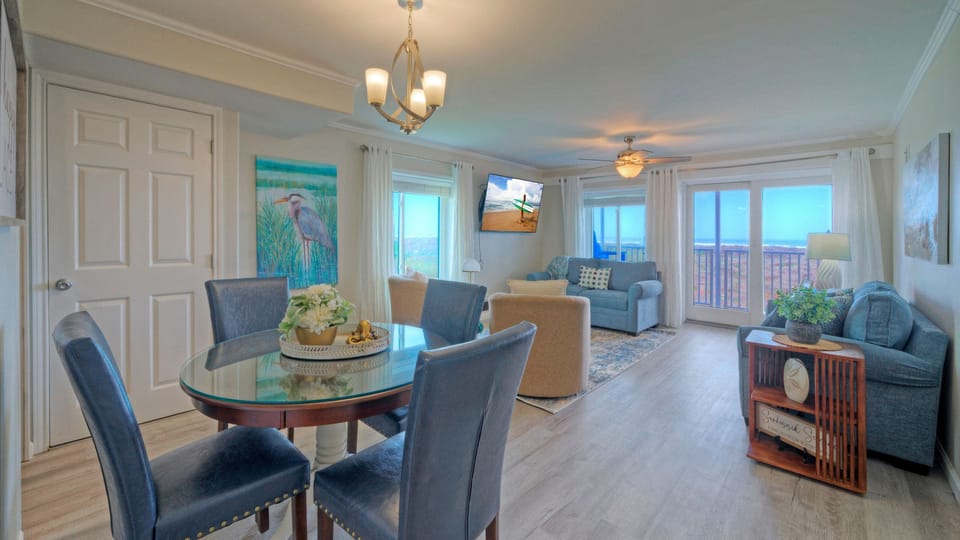 Bright and airy layout showing the seamless transition between the living and dining.