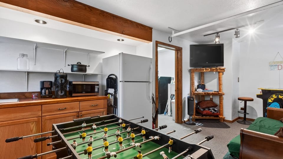 A game room with foosball, arcade fun, and a lounge area adds extra entertainment for the whole group.