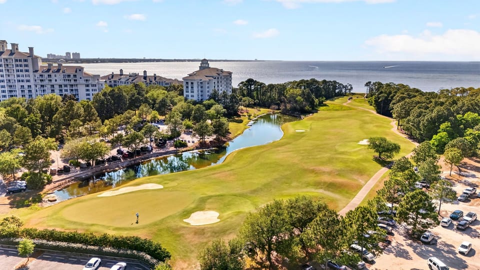 Golf course greens and winding waterways.