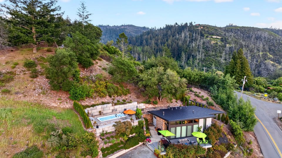 Wide aerial shot showing the property's seclusion and natural beauty.