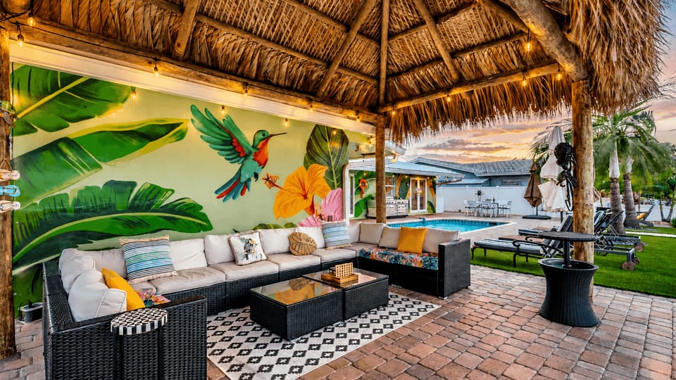 Covered outdoor bar and lounge under the Tiki hut.