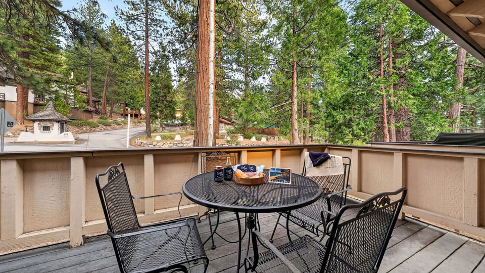 Private deck dining set among the pines—perfect for morning coffee or evening drinks.