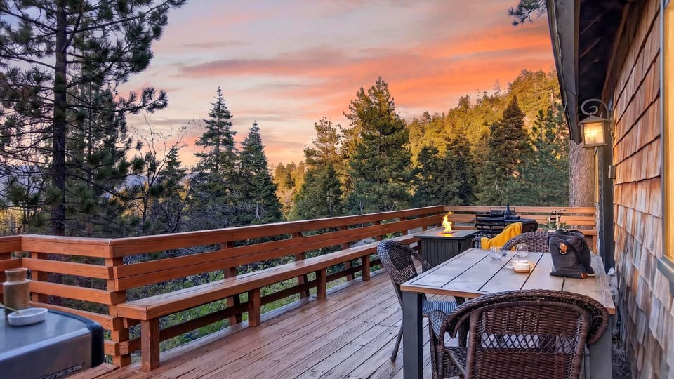 Golden hour over the pines—experience breathtaking sunset views from your private, expansive wrap-around deck.