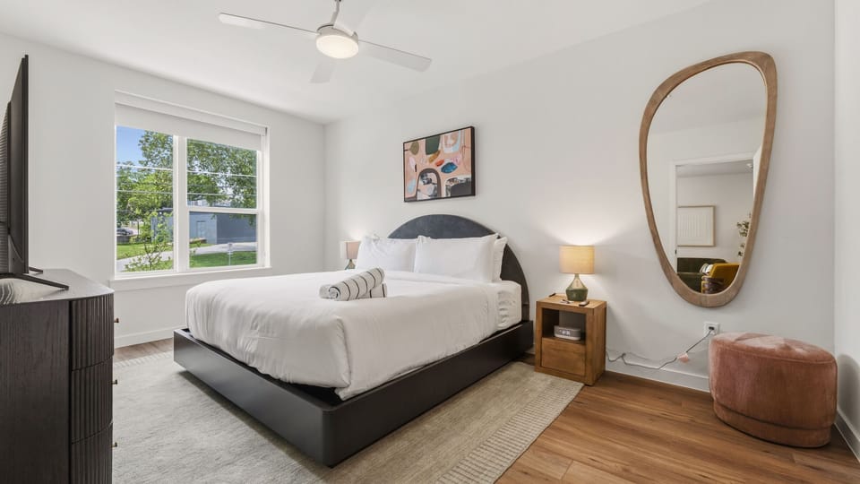 Bedroom 1 features a king bed and ensuite bathroom. (Unit 310)