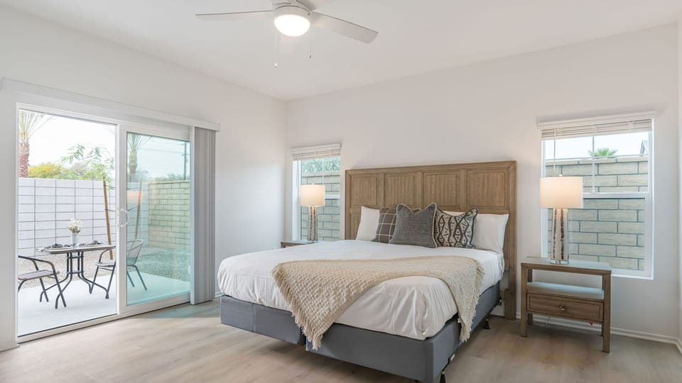 The primary bedroom features a king bed with a TV and an ensuite bathroom. (Summerwell 4)