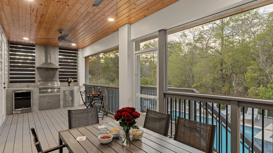 Covered outdoor patio with al fresco dining and built-in BBQ grill. (Graytness)