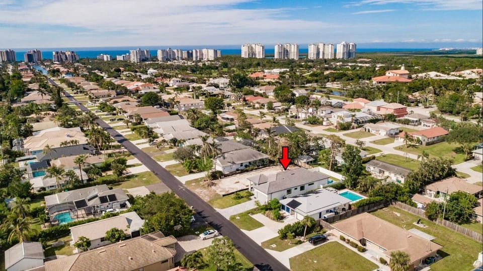 Aerial view showing the property’s proximity to the coast and surrounding amenities.