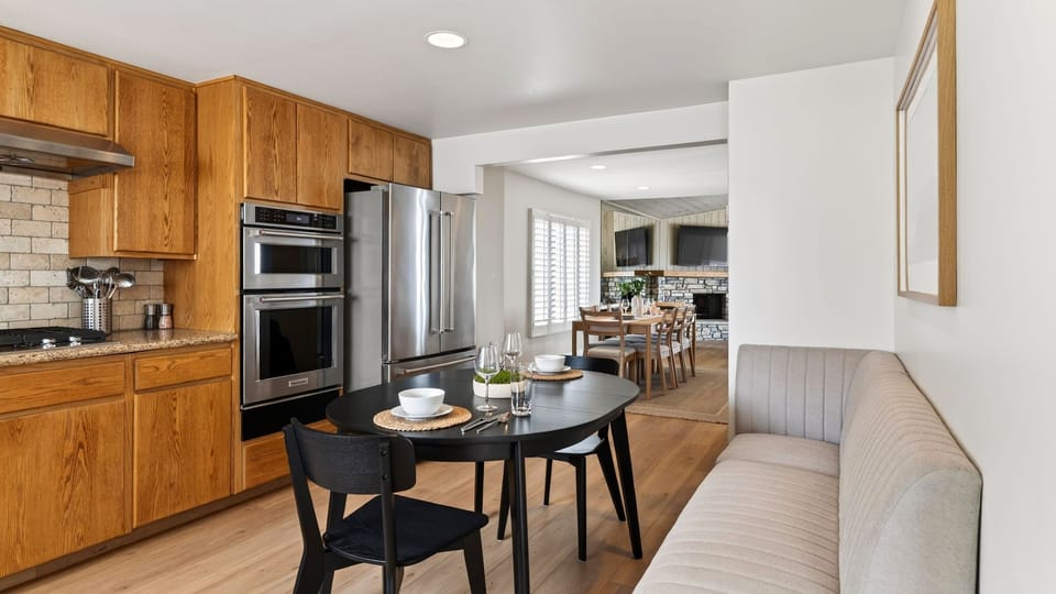 Cozy breakfast nook just off the kitchen with easy flow into the open-concept living and dining spaces.