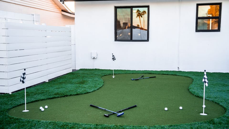 Custom-designed backyard putting green, perfect for practicing your short game in the privacy of your own home.