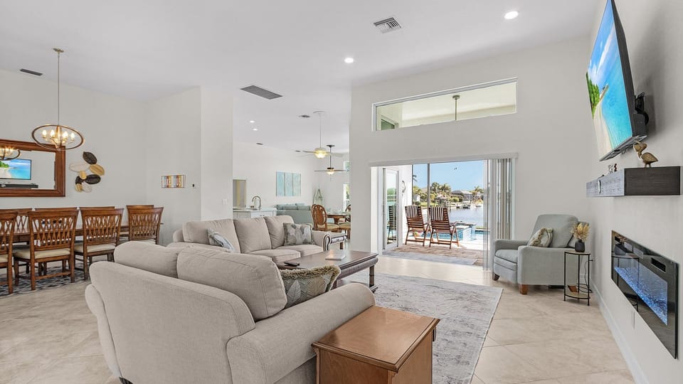 Steps inside, an expansive open floor plan greets you, showcasing a seamless flow designed for entertaining and relaxing.