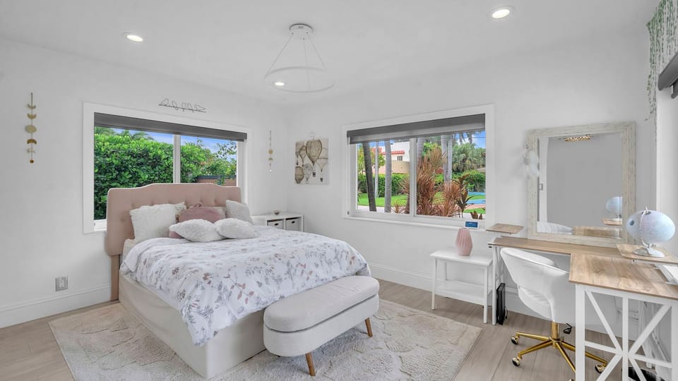 Bedroom 2 features a king bed, desk and an ensuite bathroom.