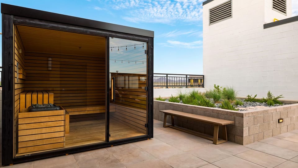 Unwind in the community sauna, set within a landscaped rooftop terrace with open-air views.
