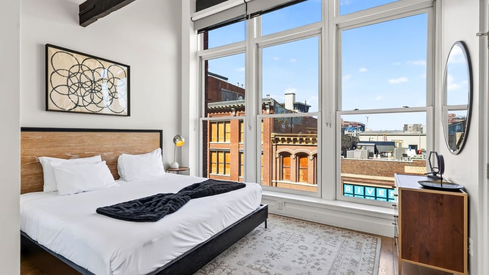 Retreat to a classic, light-filled sanctuary featuring a comfortable king-size bed and large windows overlooking the city.