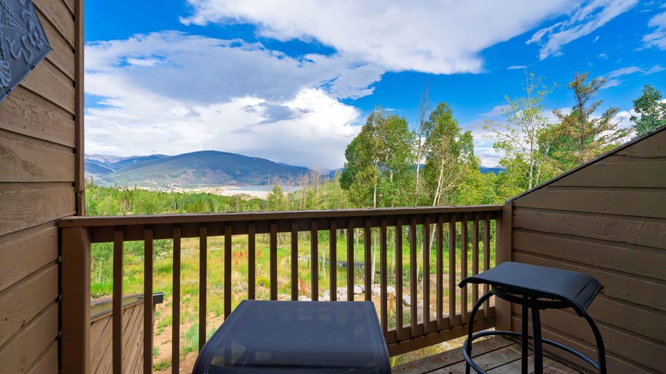 Private balcony with panoramic alpine scenery.