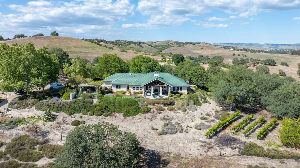 Take in hill views from the green-roofed home and gardens