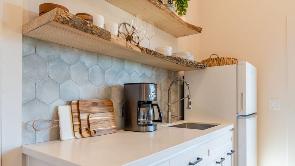 Kitchenette equipped for light meals and morning coffee.
