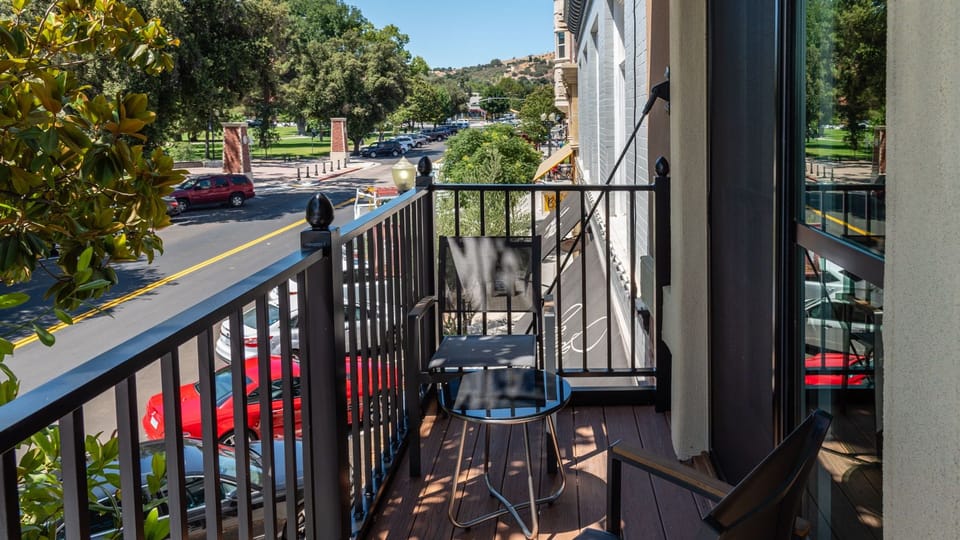 Step outside for coffee with a quiet neighborhood view