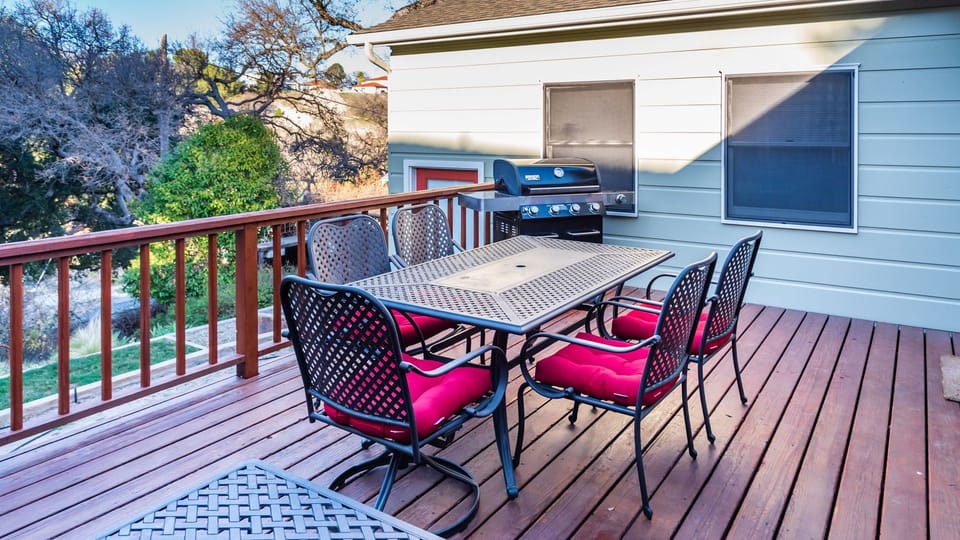 Gather for open-air meals on the spacious deck with outdoor dining and a convenient gas grill.