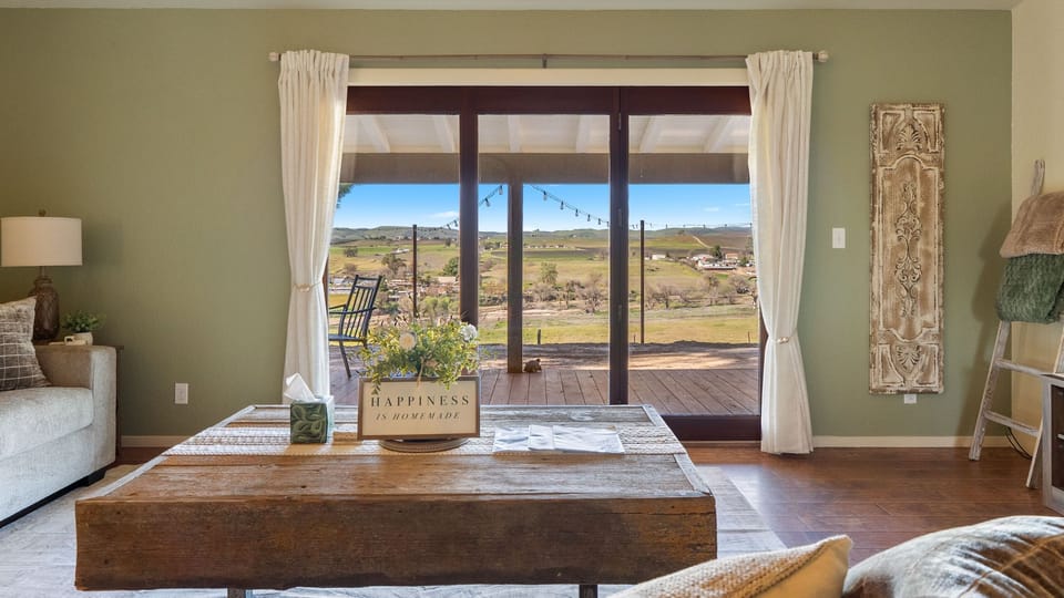 Rustic coffee table with countryside views through the sliders
